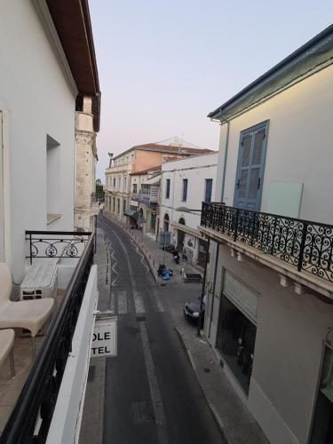 a view of a city street from a balcony at Metropole Hotel in Limassol