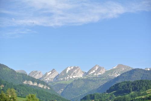 a view of a mountain range with snow at Gasthaus Gemsli in Nesslau