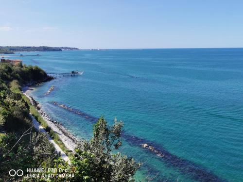 a beach with a boat in the water at Casa vacanze da Nonna Rosa Ortona in Ortona
