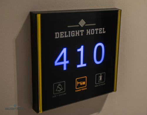 a digital clock on a wall with the number at Delight Hotel in Ksamil