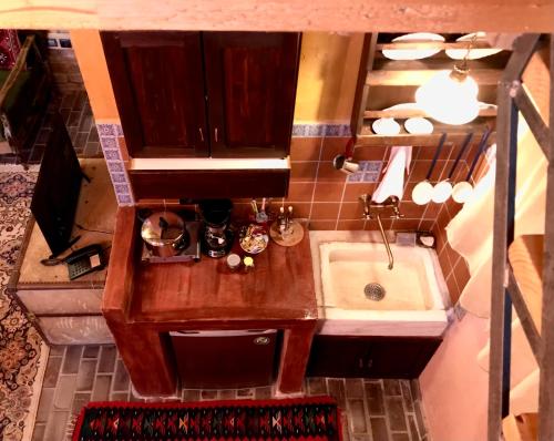 an overhead view of a kitchen with a sink at Montanema Handmade Village in Platanákos