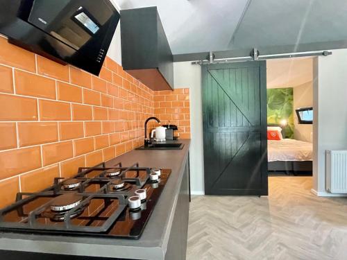 Kuchyň nebo kuchyňský kout v ubytování Tiny Lodges for2 - Kempenbos