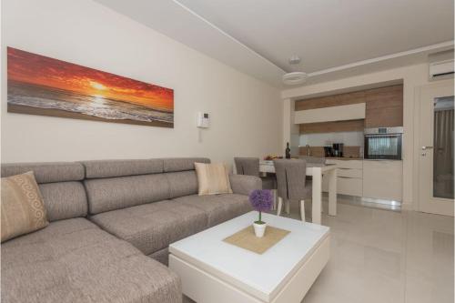 a living room with a couch and a table at Promajna Leone Erceg Apartments in Promajna