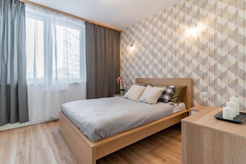 Postel nebo postele na pokoji v ubytování WrocApartments StarCenter - Parking Free
