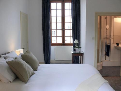 מיטה או מיטות בחדר ב-Gites Aubelle - La Maison Aubelle