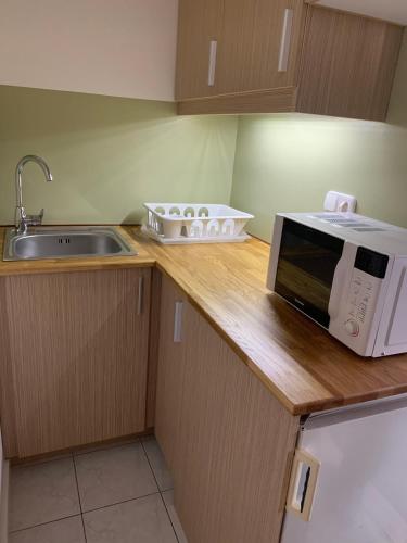Kuchyň nebo kuchyňský kout v ubytování Hollik Apartmanház