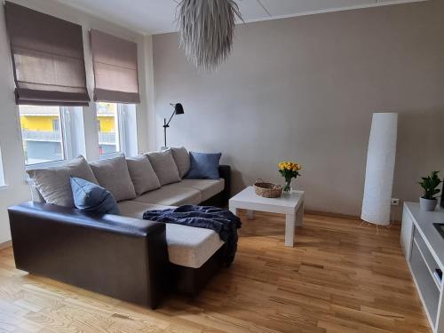 a living room with a couch and a table at R63 Apartment with Terrace in Tartu