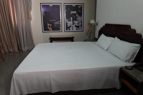 Ένα ή περισσότερα κρεβάτια σε δωμάτιο στο HOTEL OSCAR GOLD