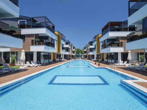 an image of a swimming pool at a hotel at Elysium Green Suites in Antalya