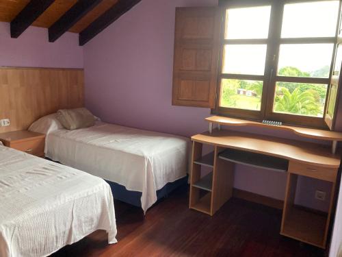 Giường trong phòng chung tại El Rincón del Valledal