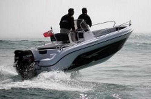 two men on a boat in the water at Apartments Lovrić in Vodice