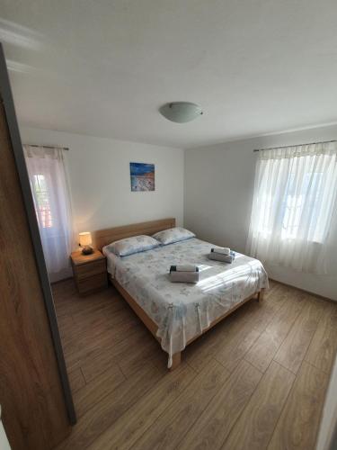 Posteľ alebo postele v izbe v ubytovaní Apartaments Ukić
