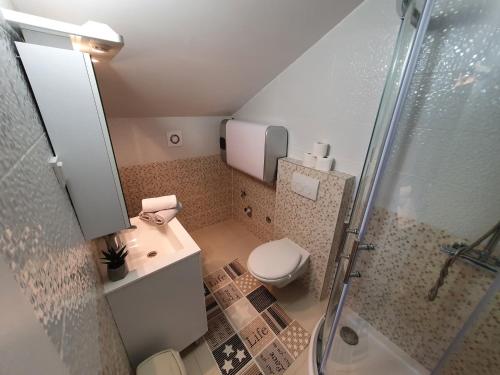 Ванна кімната в Apartaments Ukić