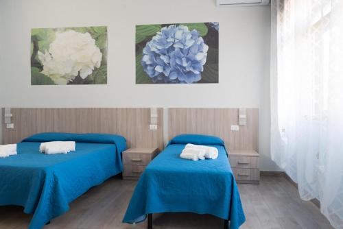Кровать или кровати в номере B&B Il giardino dei sogni