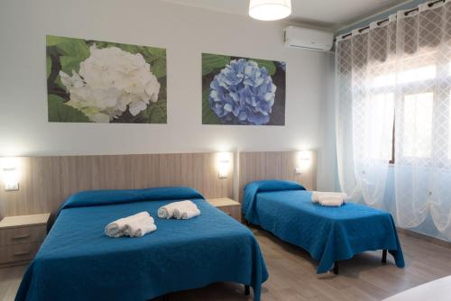 Кровать или кровати в номере B&B Il giardino dei sogni