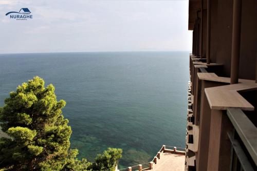 a view of the ocean from a building at Nuraghe Apartments in Teulada