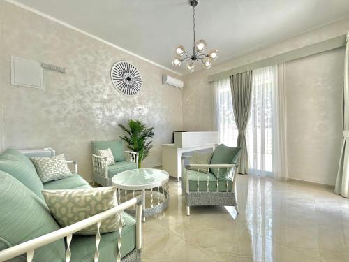 a living room with a couch and chairs and a table at Seaside Apartments Sword in Bar