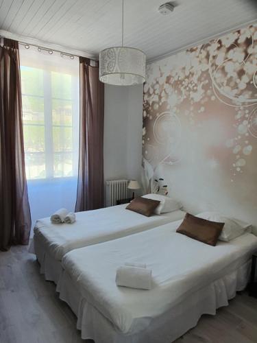 Postel nebo postele na pokoji v ubytování Ma Petite Auberge