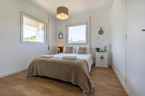 Giường trong phòng chung tại Charming Country House