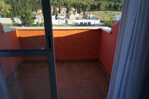 a balcony with a view of a house at El Valle in Murcia