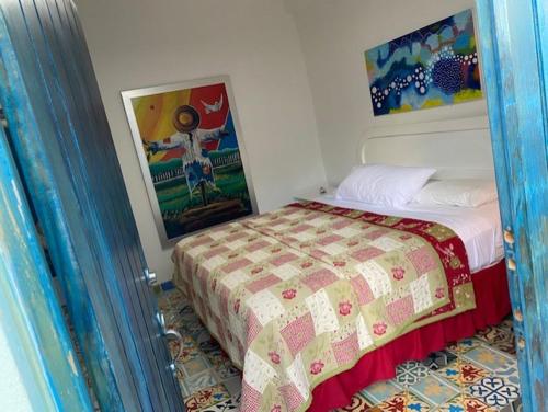 Postel nebo postele na pokoji v ubytování Chao Mamá Hostal