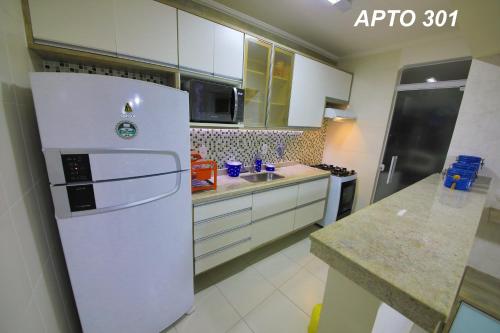 Dapur atau dapur kecil di LINDO NOVISSIMO e PÉ NA AREIA