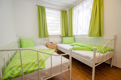 Ένα ή περισσότερα κρεβάτια σε δωμάτιο στο Appartementhaus Kitzsteinhorn