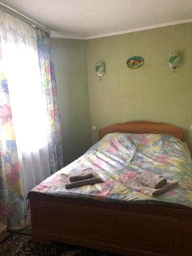 Кровать или кровати в номере Садиба Диво Квітка