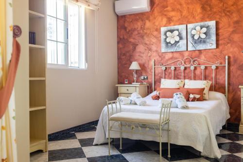 Ένα ή περισσότερα κρεβάτια σε δωμάτιο στο Villa Soraida
