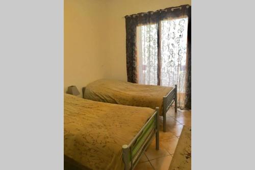 Ein Bett oder Betten in einem Zimmer der Unterkunft Smir Park appartement Haut standing Marina Smir