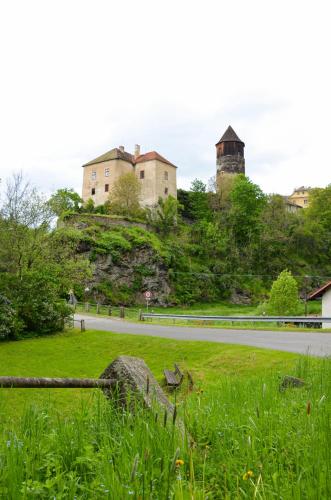 a house on top of a hill with a road at Apartmán Kampelička in Rataje nad Sázavou
