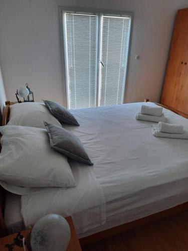 Ένα ή περισσότερα κρεβάτια σε δωμάτιο στο Apartments Marijana