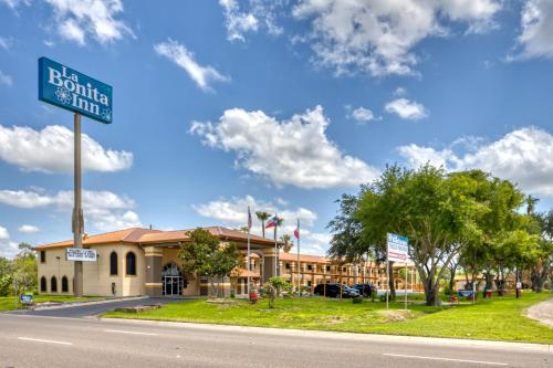 a sign for a hotel on the side of the road at Texas Inn Donna in Donna