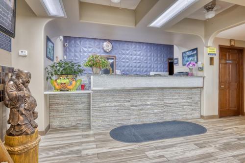 a bar in a lobby with a counter at Texas Inn Donna in Donna