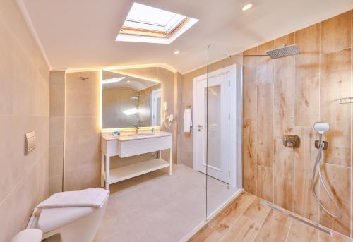 a bathroom with a toilet and a sink and a shower at Hilaris Kas in Kaş