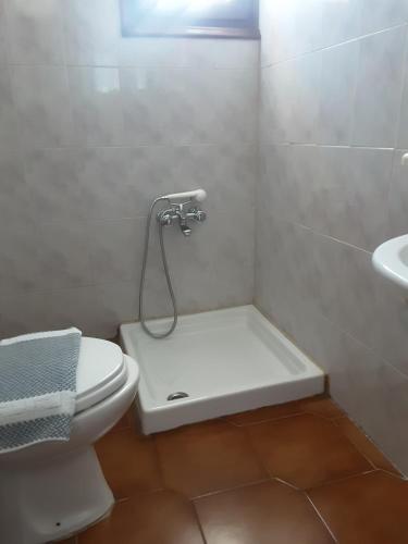 a bathroom with a toilet and a sink at Magda Studios - Double Bed Room N4 in Zagora