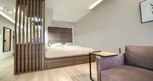 Postel nebo postele na pokoji v ubytování Apartament LOFT Centrum Apr-Kws z garażem FaktVat