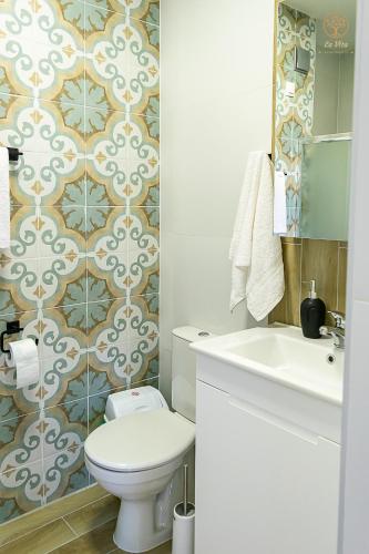 a bathroom with a toilet and a sink at La Vita Apartment 2 in Ohrid