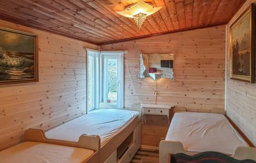 Кровать или кровати в номере Skudeneshavn 182 Fish Camp
