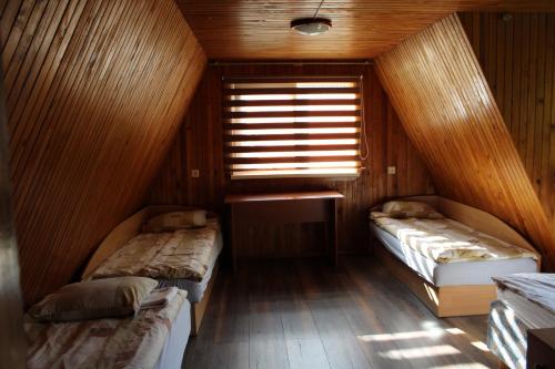 Postel nebo postele na pokoji v ubytování Kaimo turizmo sodyba "Puozo Sodyba"