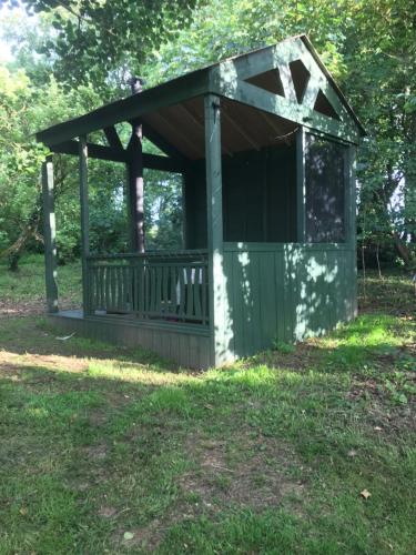 a gazebo in the grass in a field at Deeleview apartment in Lifford