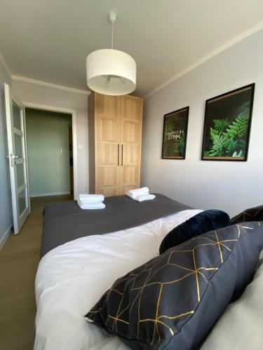 Posteľ alebo postele v izbe v ubytovaní Apartament Długie Ogrody