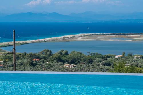 an island in the middle of a body of water at Voula Villa Luxury in Lefkada