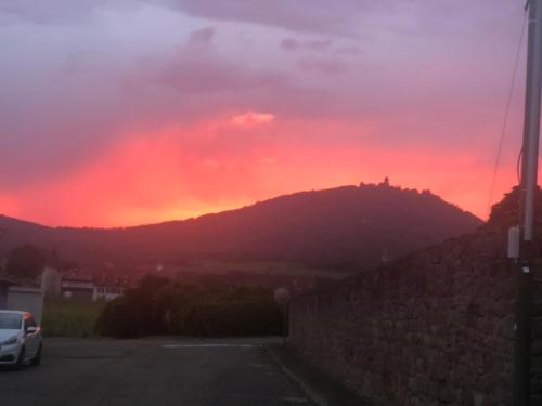a sunset over a mountain with a red sky at La Maison de juliette in Saint-Hippolyte