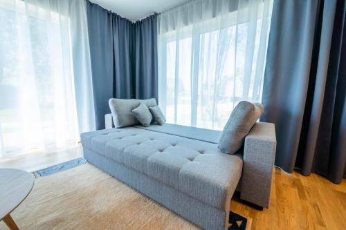 A bed or beds in a room at Delta Luxury Apartment with terrace
