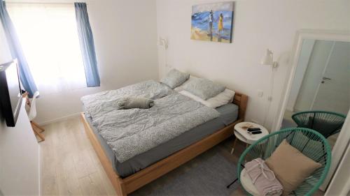 a small bedroom with a bed in a room at The Duke in Šibenik