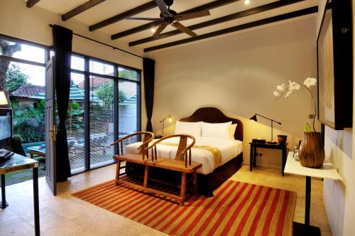 Ένα ή περισσότερα κρεβάτια σε δωμάτιο στο Room & Vespa 1 - Stay Central Seminyak Near Beach