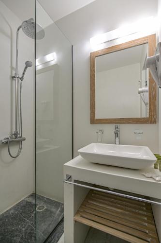 a bathroom with a sink and a mirror at Soula Naxos in Naxos Chora