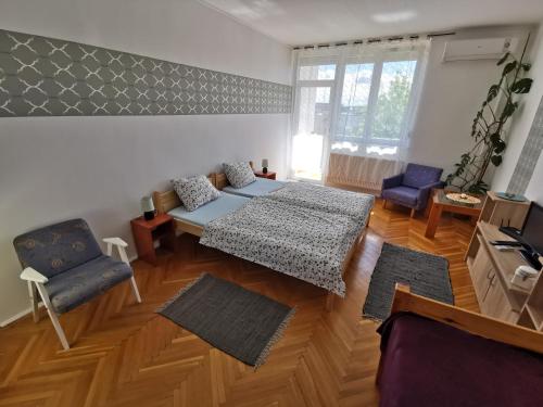 a living room with a couch and a table at Acceptus Domus in Szombathely