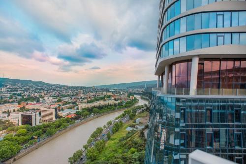 a view of a river and a building at Meta Business Hotel By King David in Tbilisi City